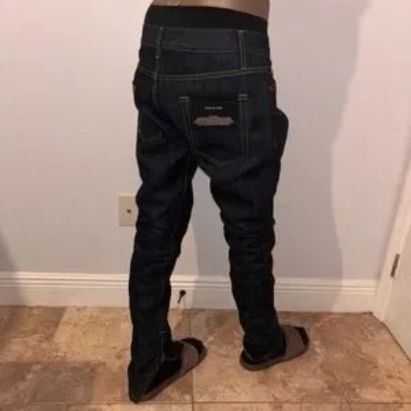 Stylish men's new, unworn (NWT) raw denim jeans from Fear of God, featuring a 30 - Picture 12 of 13